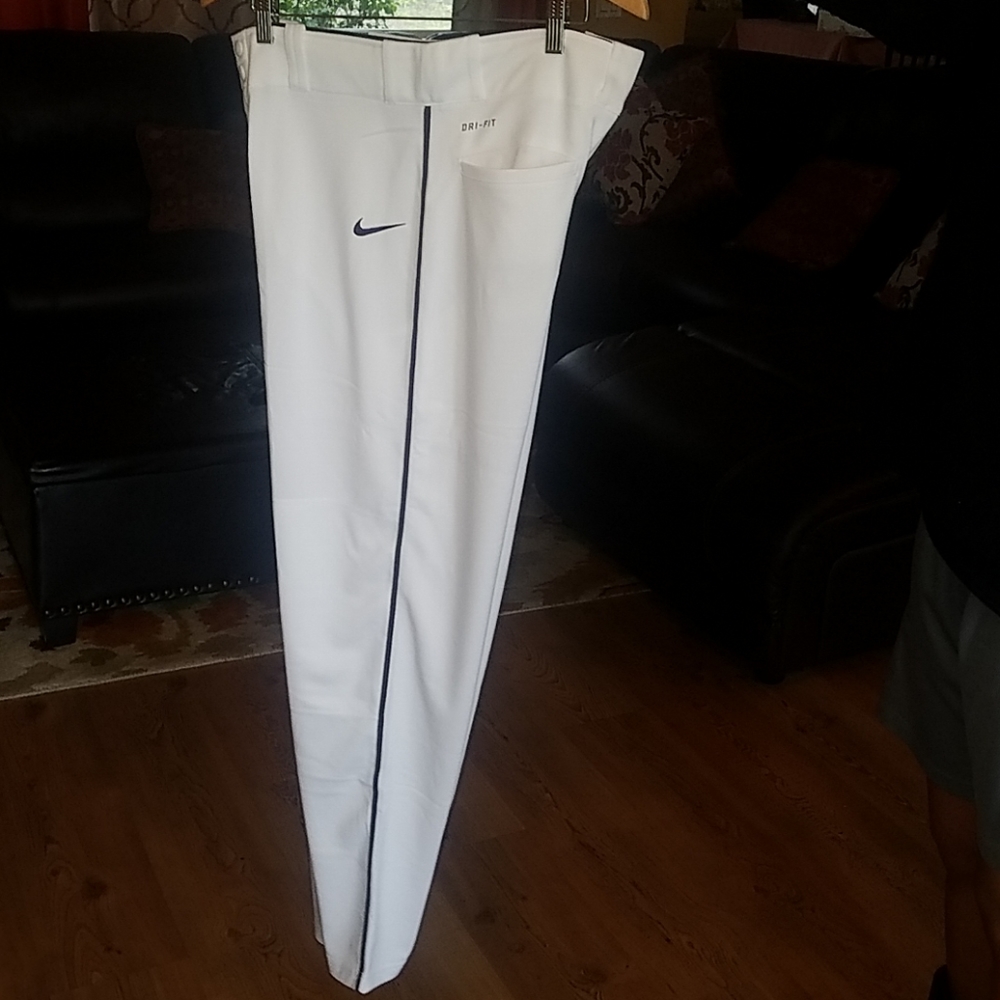 Nike white dri-fit baseball pants with bulk stripe